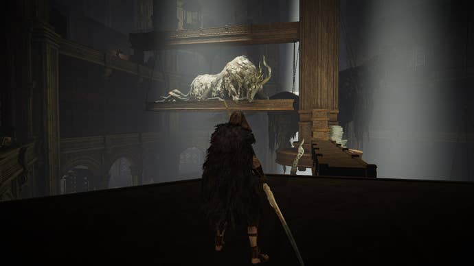 The Tarnished looks toward some statues in the center of the Specimen Storehouse in Elden Ring Shadow of the Erdtree