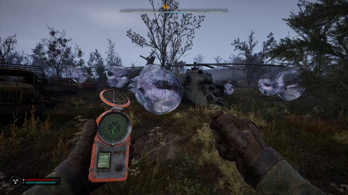 Anomalous bubbles surround an abandoned helicopter in S.T.A.L.K.E.R. 2: Heart of Chornobyl.
