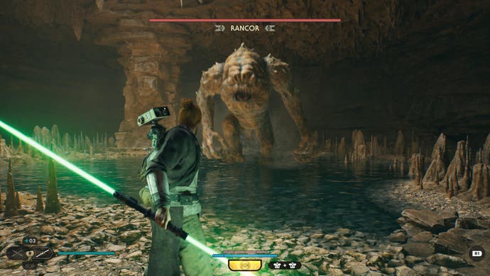 Star Wars Jedi Survivor review - screenshot showing Cal facing off with a green double lightsaber against a Rancor