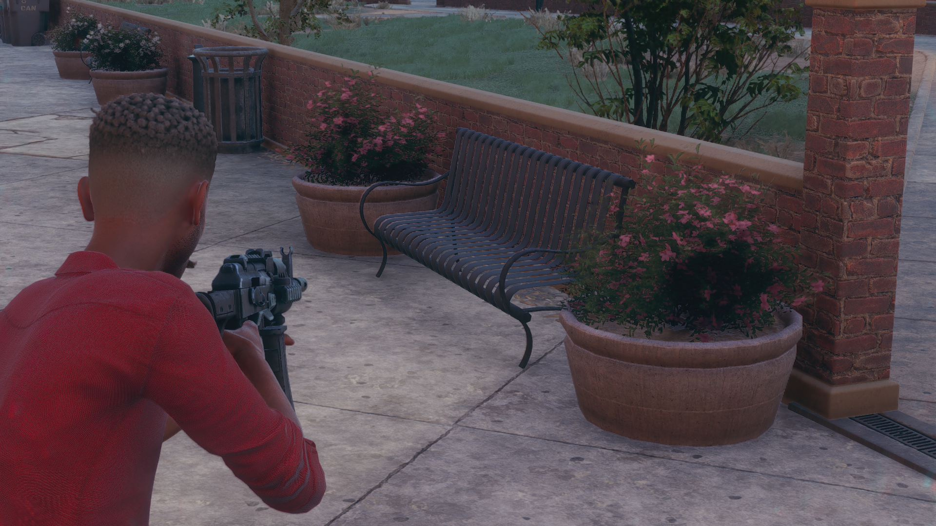 A bench and some planters showing ray traced ambient occlusion, on its Low setting, in Saints Row.