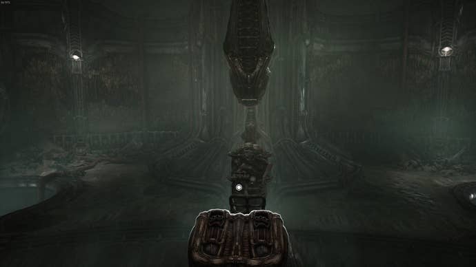 A creature is seated below an alien machine in Scorn's Act 1