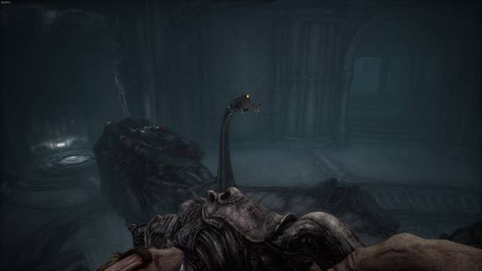The player faces a lever with a capsule inside it's mouth in Act 5 of Scorn