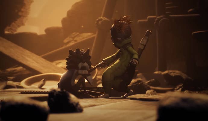 Little Nightmares 3 screenshot showing its two masked child protagonists interacting in a hazy, dilapidated environment.