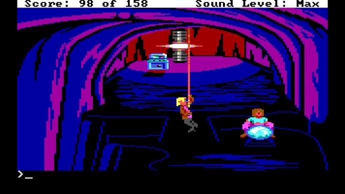 Dodger climbs down a rope in Tachyon Dreams Anthology into a deep cave. A figure is bent over a crystal ball and there’s a glinting machine in the background.