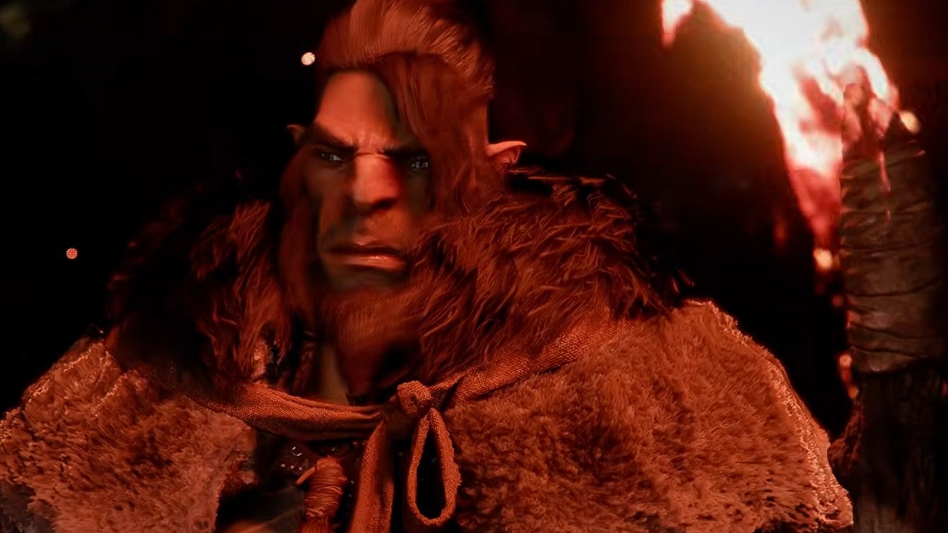 Screenshot from Crimson Desert's launch trailer showing a bearded male holding a flaming torch