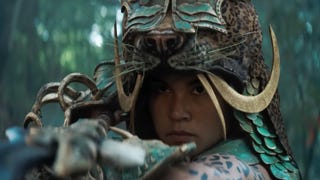 Screenshot from Diablo 4 Vessel of Hatred live action trailer showing a warrior with a cheetah style head dress in a jungle