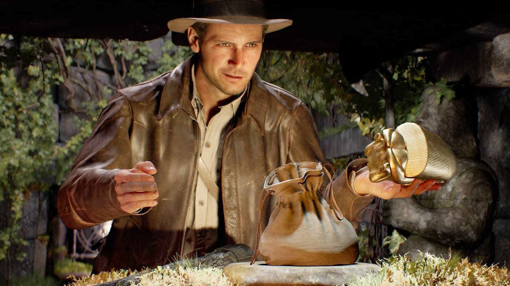 Screenshot from Indiana Jones and the Great Circle showing Indy holding up a golden idol inside a large cave like room covered in foliage