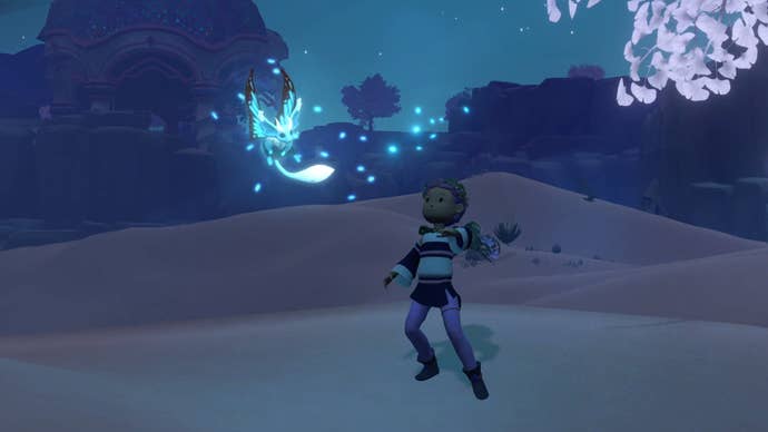 Screenshot from Wildmender showing a male character in a desert area at night as a glowing creature flies above them