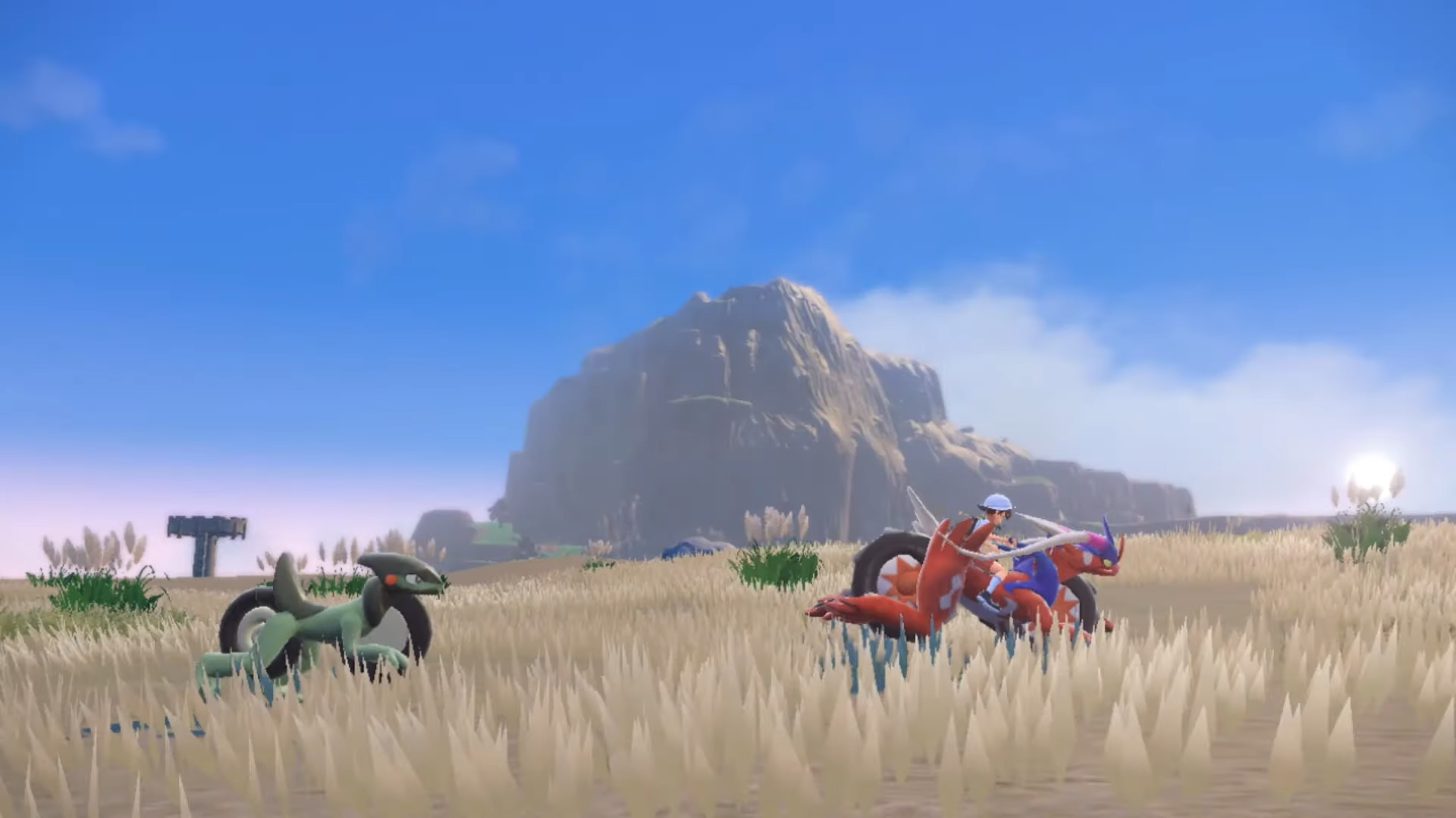 Koraidon and Cyclizar in Pokemon Scarlet and Violet