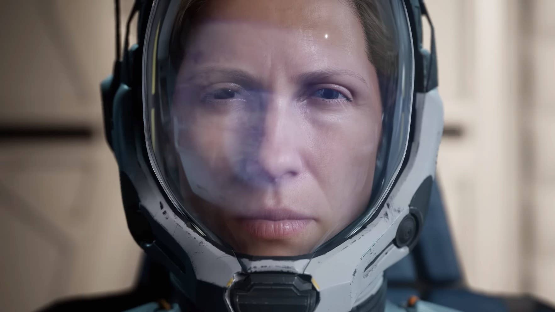Selene from Returnal sits in her craft wearing a space helmet