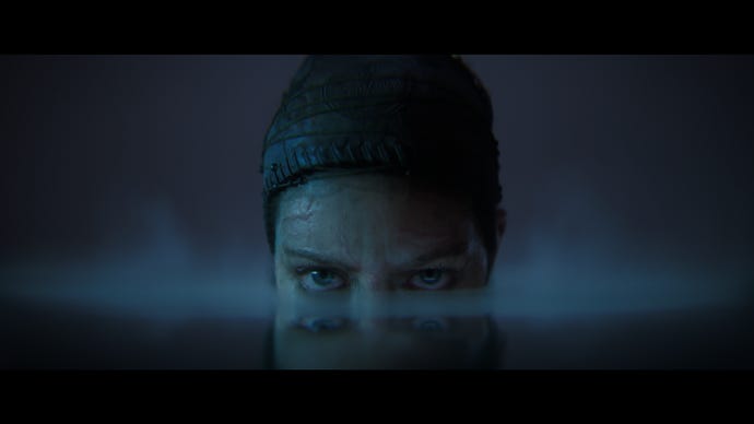 Senua lurks menacingly in a pool of still water in a Senua’s Saga: Hellblade 2 cinematic.