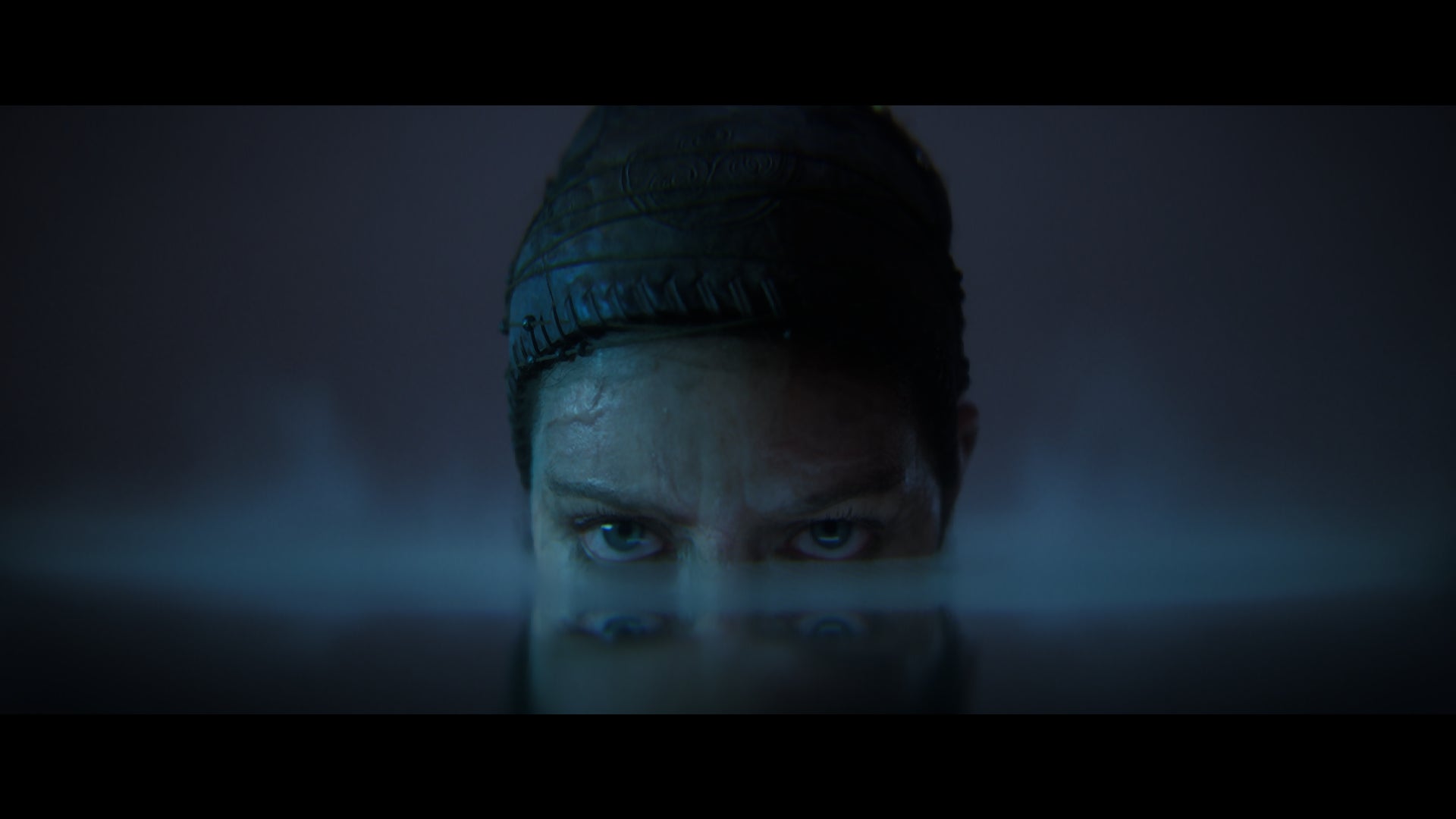 Senua lurks menacingly in a pool of still water in a Senua's Saga: Hellblade 2 cinematic. - 6