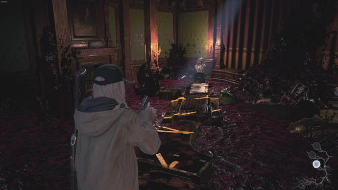 Rose looks toward a bust wearing the golden mask in Resident Evil Village's Shadows of Rose DLC