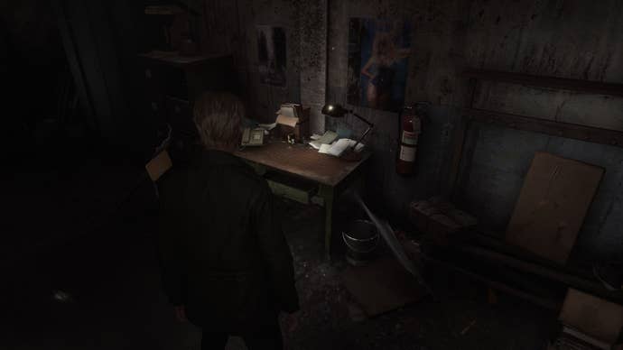 James stands inside Best Auto Parts in the Silent Hill 2 remake