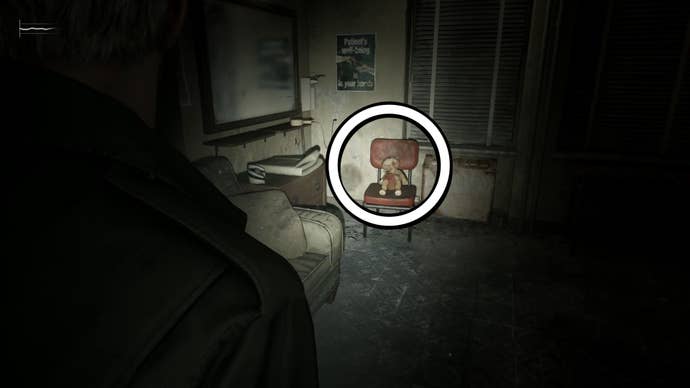A white circle showing a teddy bear containing the Bent Needle item in Silent Hill 2.