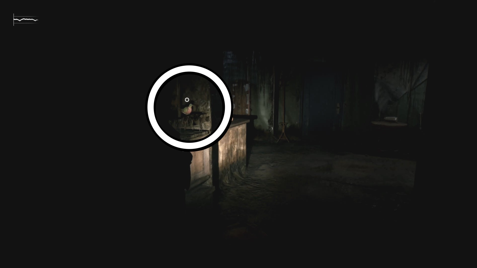 A white circle showing the Pigeon Figurine inside a broken cabinet in Silent Hill 2.