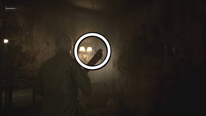 A white circle showing a Swan’s Head figurine handing from the ceiling in Silent Hill 2.