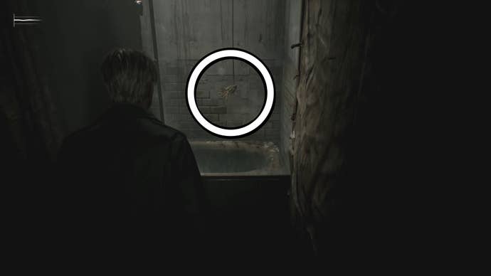 A white circle showing the moldy body of a swan figurine hanging from the ceiling above a bath in Silent Hill 2.