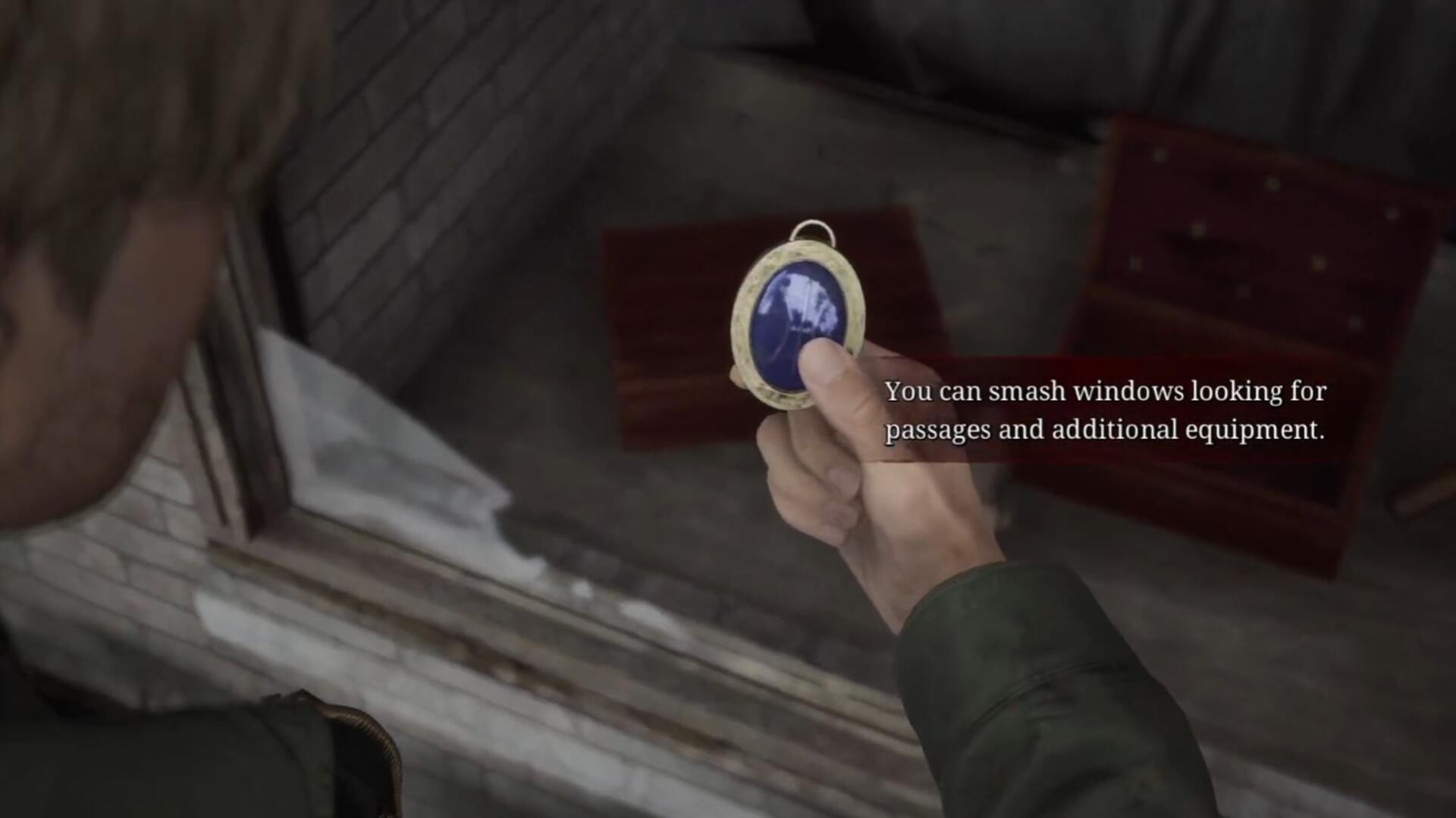 James holds the Blue Gem after retrieving it from the Jeweler's storefront in East South Vale in the Silent Hill 2 remake - 1