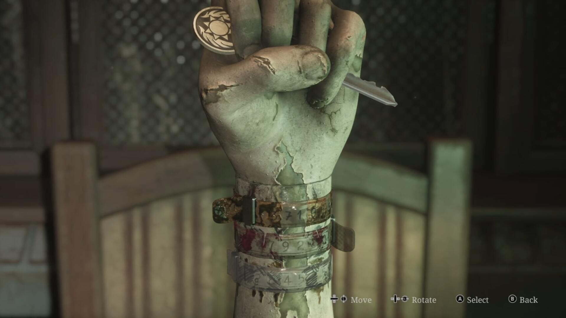 James interacts with a hand and three bracelets in the Brookhaven Hospital Director's Office of the Silent Hill 2 remake