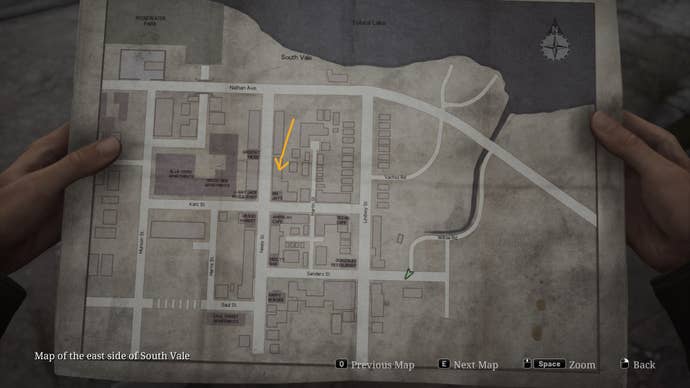 The map of East South Vale in the Silent Hill 2 remake is shown, with the location of the Blue Gem marked by a yellow arrow