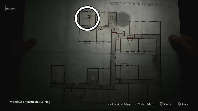 A white circle showing the location of the Handgun in Room 217 of Wood Side Apartments in Silent Hill 2.