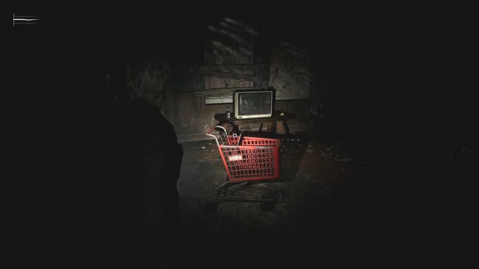 James looking at the Handgun in a red shopping cart in Silent Hill 2.