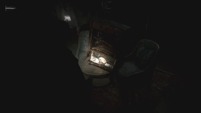 James looks at the fallen radio at the Blue Creek Apartments in Silent Hill 2.