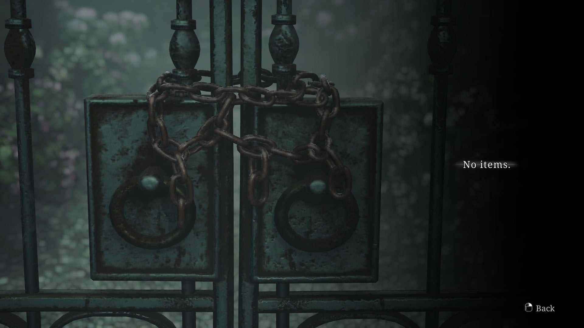 A chained gate in the Lake View Hotel Garden is shown in the Silent Hill 2 remake