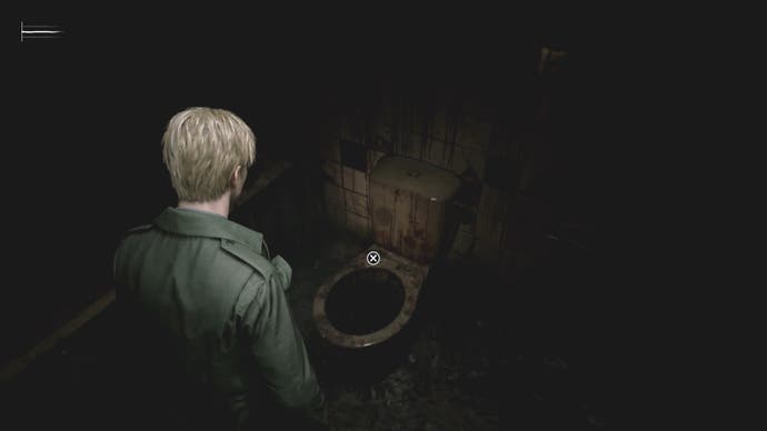 James looks at a very disgusting toilet in Silent Hill 2.