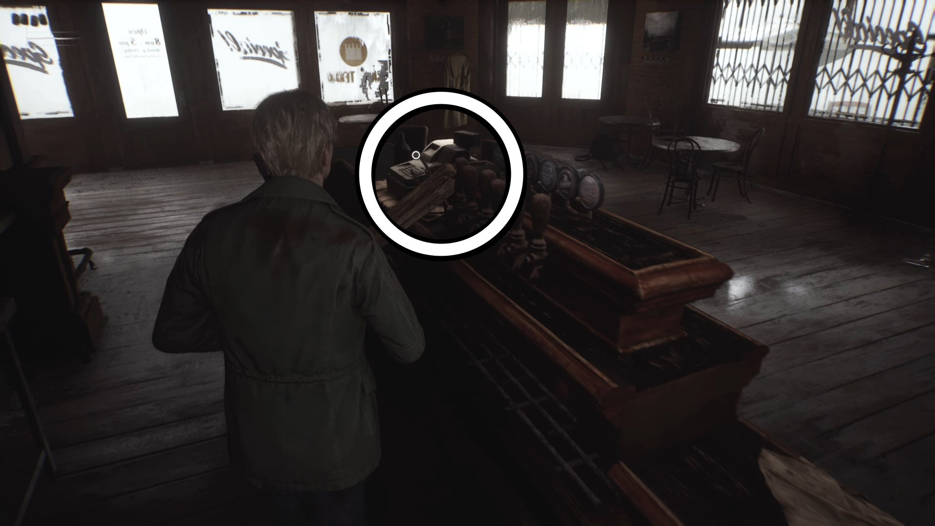 A white circle showing the cash register containing Neely&rsquo;s Bar Coin in Texan Cafe in Silent Hill 2.