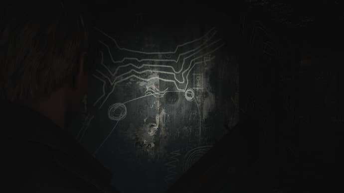 James looks at the walls of Wood Side Apartment’s Room 206 in the Silent Hill 2 remake