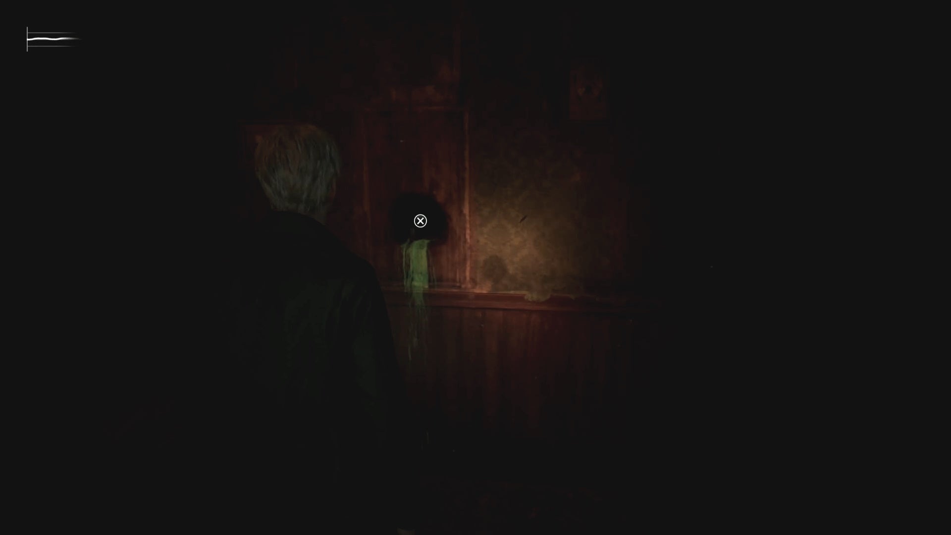 James looking at a hole in a wall with green liquid dripping from it in Silent Hill 2.