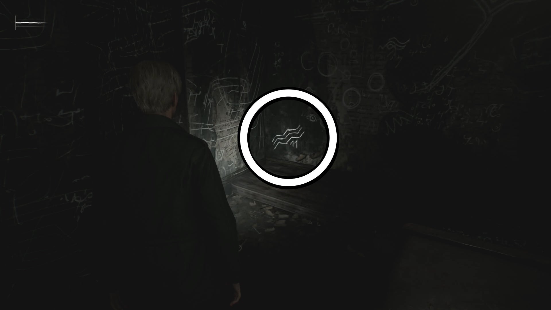 A white circle showing a picture on the wall for the Room 206 safe code puzzle solution in Silent Hill 2.