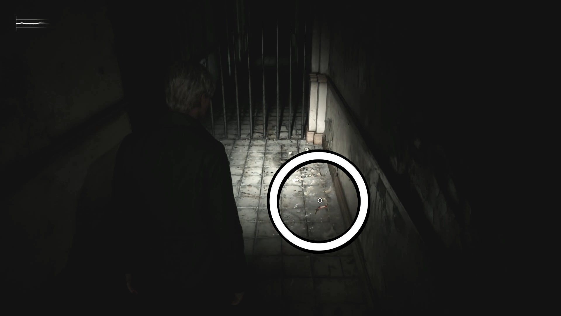 A white circle showing the 2F Hallway Key on the floor in Silent Hill 2.