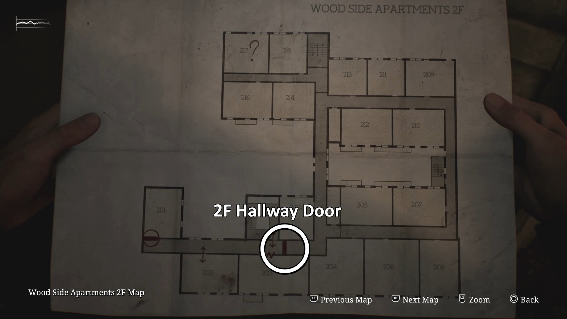 White circle and text showing the 2F Hallway door of Wood Side Apartments in Silent Hill 2.