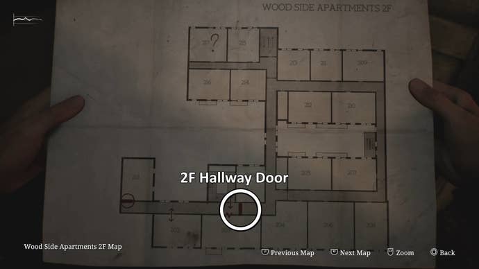 White circle and text showing the 2F Hallway door of Wood Side Apartments in Silent Hill 2.