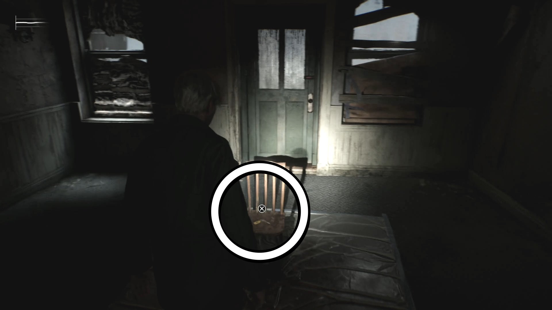 White circle showing the 2F Small Staircase Key on a chair in Silent Hill 2.