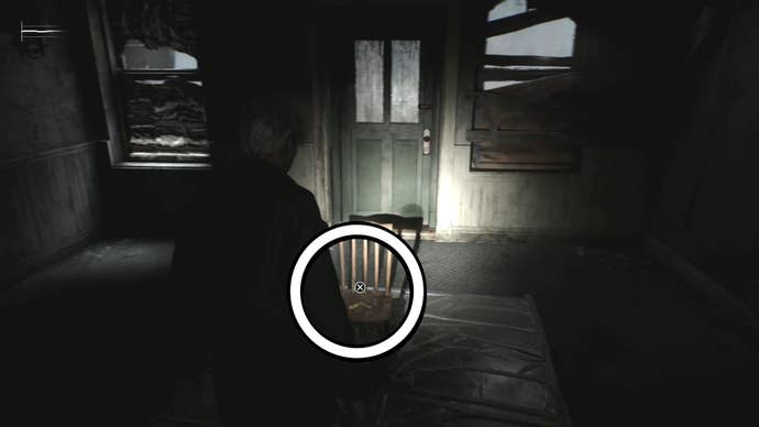 White circle showing the 2F Small Staircase Key on a chair in Silent Hill 2.