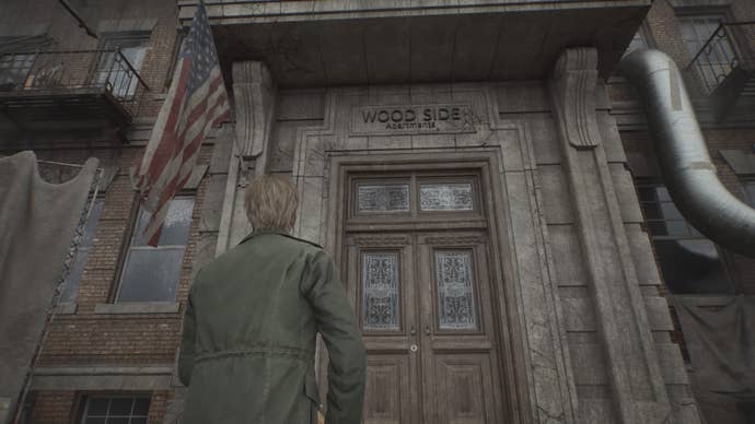 James looking up at the Wood Side Apartments building sign in Silent Hill 2.