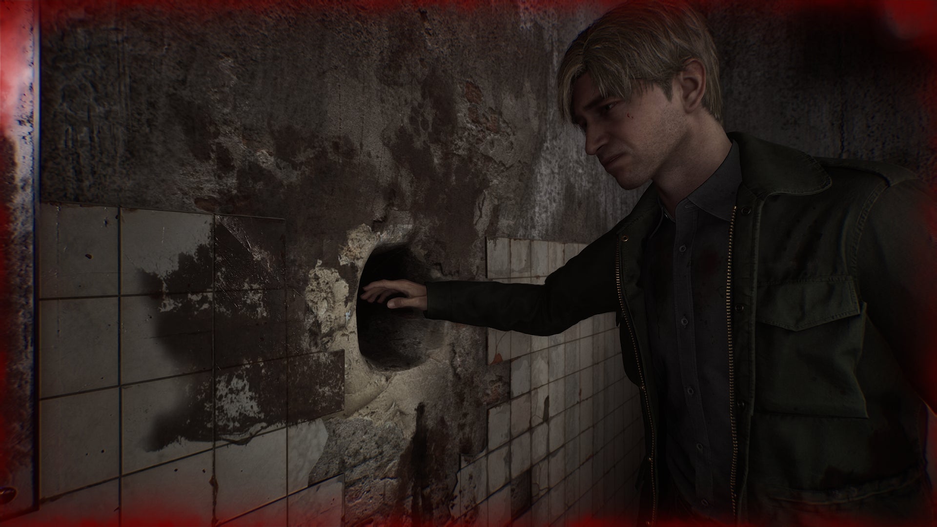 James nervously prepares to stick his hand in a mysterious hole in the wall the Silent Hill 2 remake. - 1