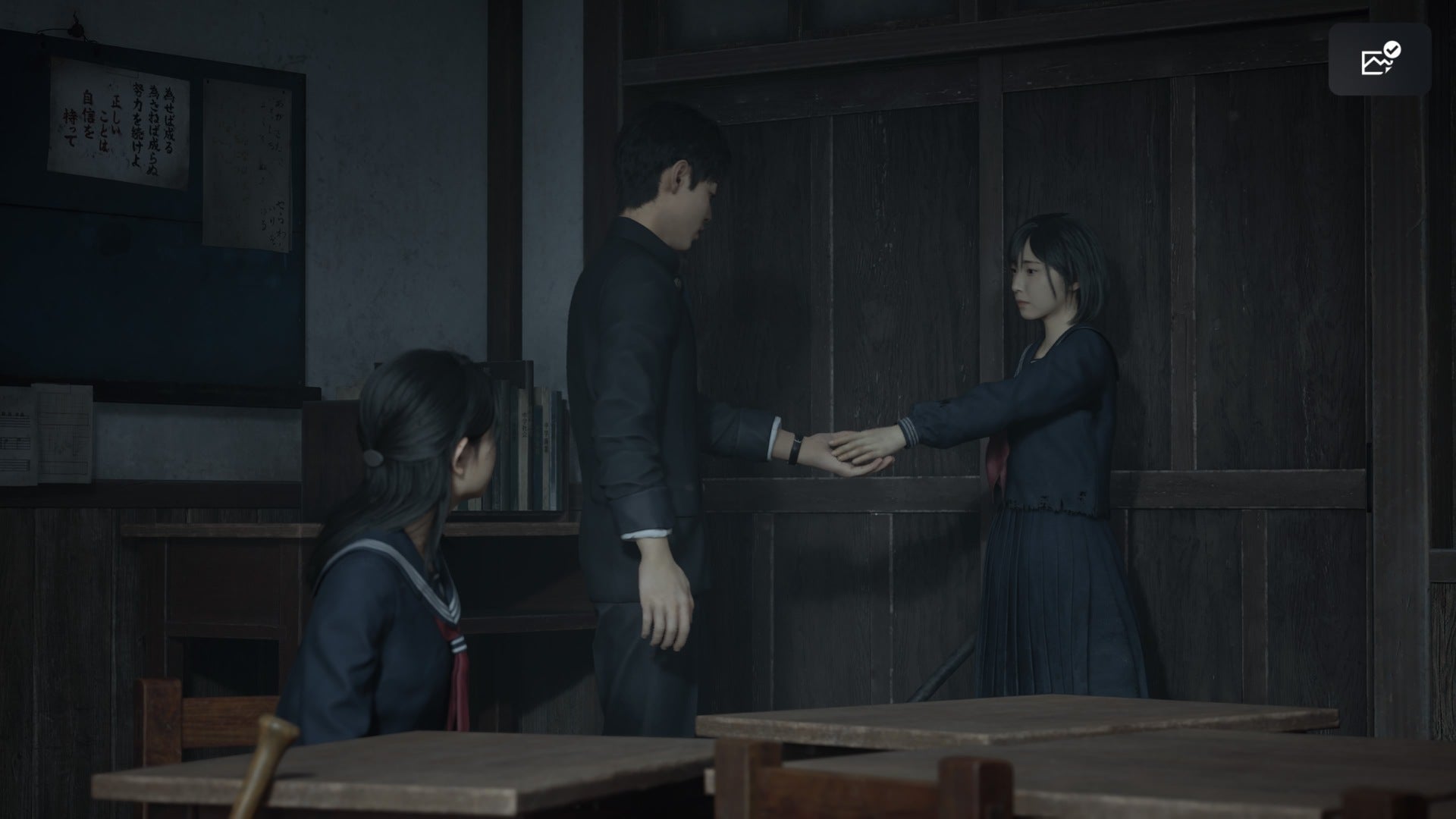 Hinako can be seen handing a key to Shu while Rinko sits nearby in the school in Silent Hill f