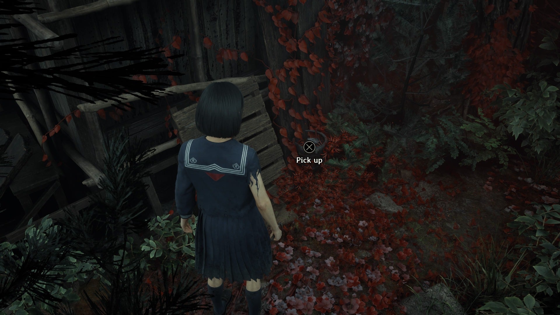 Hinako looks at the Brazier on the floor in Silent Hill f