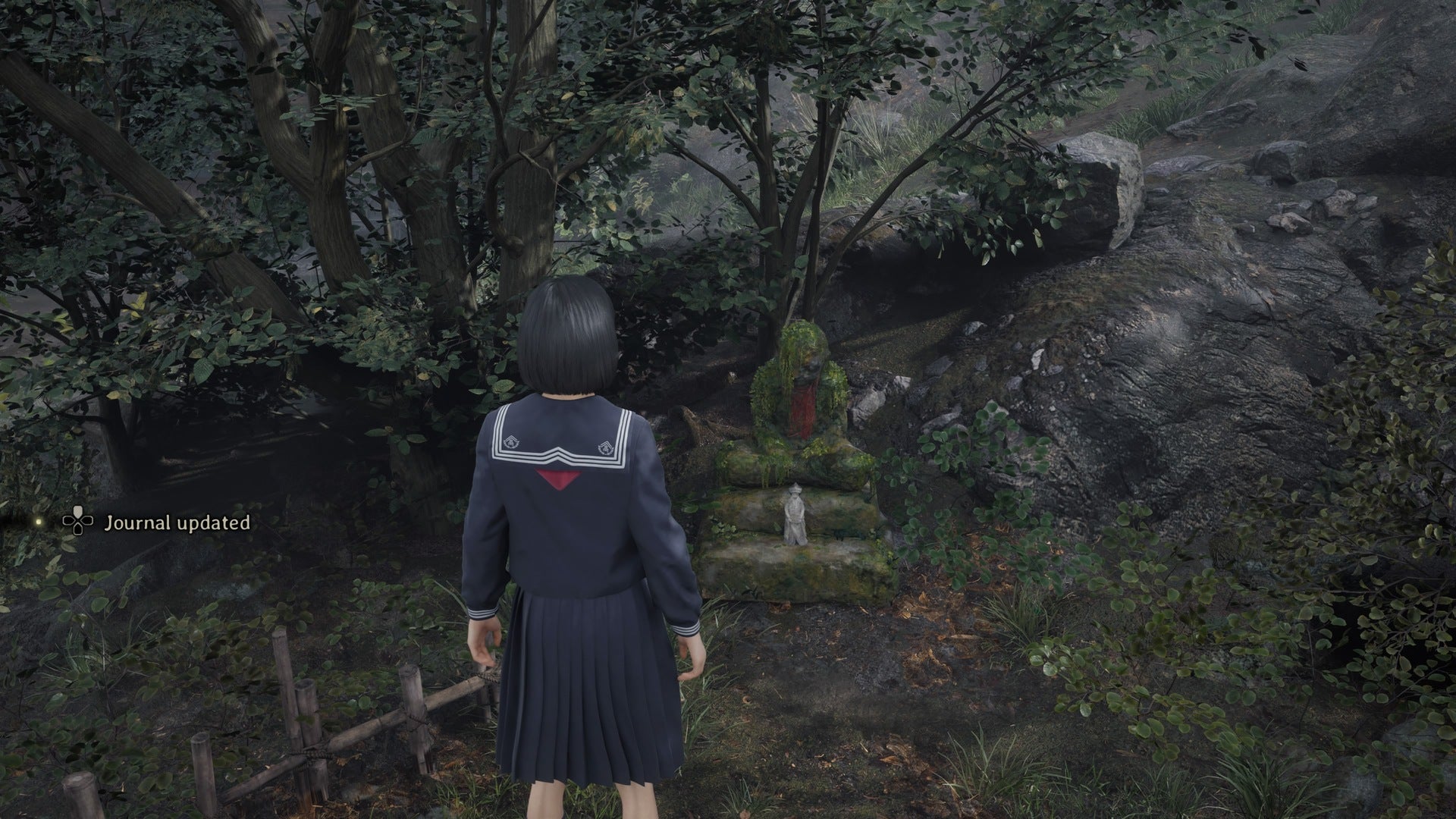 Hinako looks at the first jizu statue in Silent Hill f