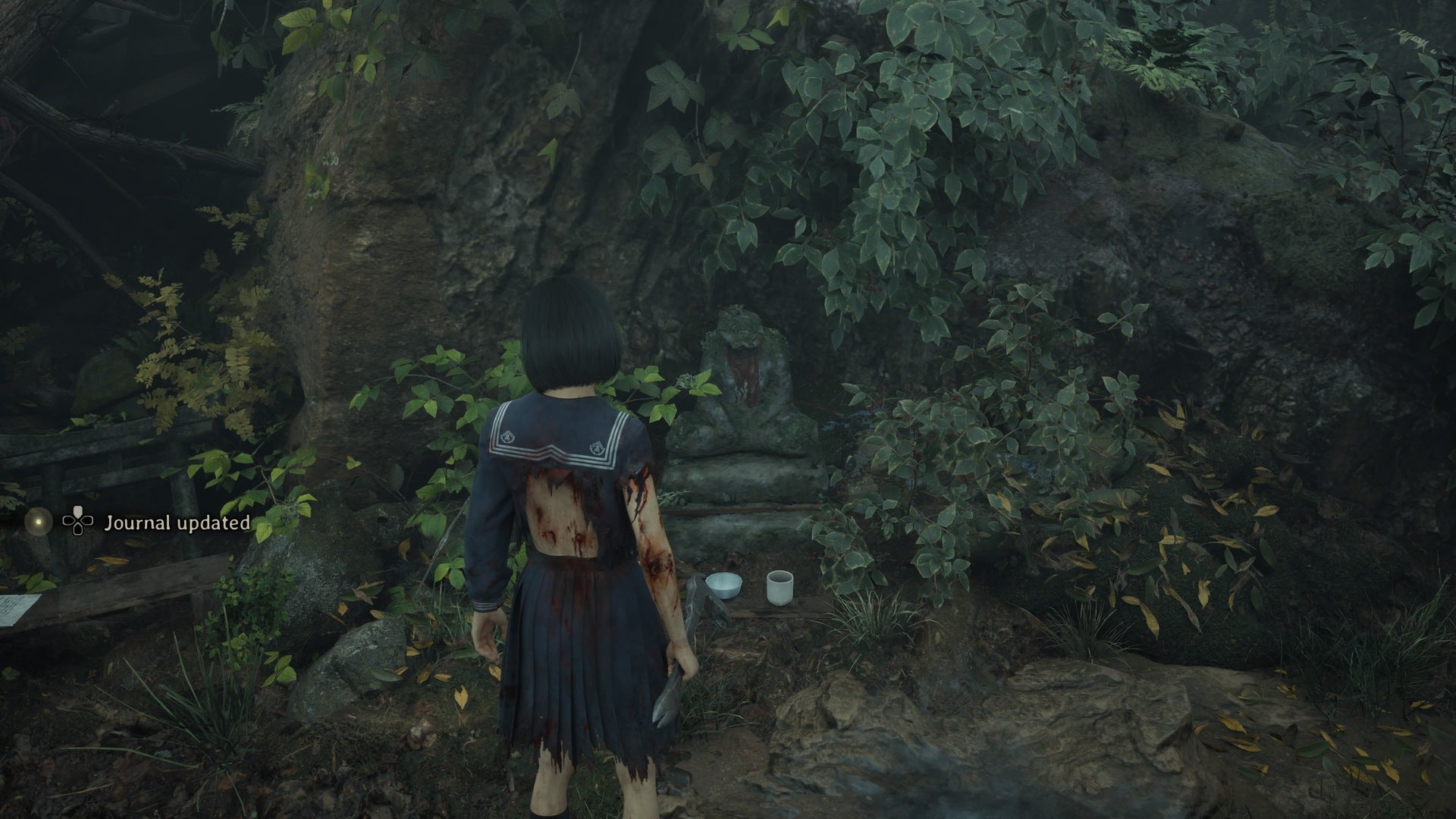 Hinako looks at the fifth jizu statue in Silent Hill f