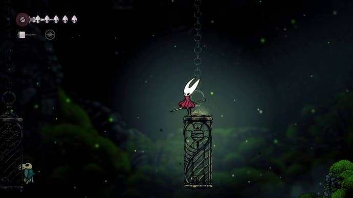 Hornet stands atop a hanging crate in Hollow Knight: Silksong