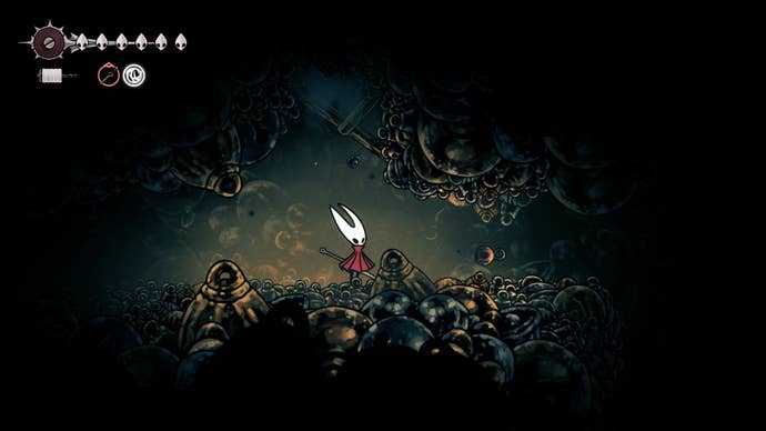 Hornet stands in Bellhart beneath where some wooden beams can be destroyed in Hollow Knight: Silksong