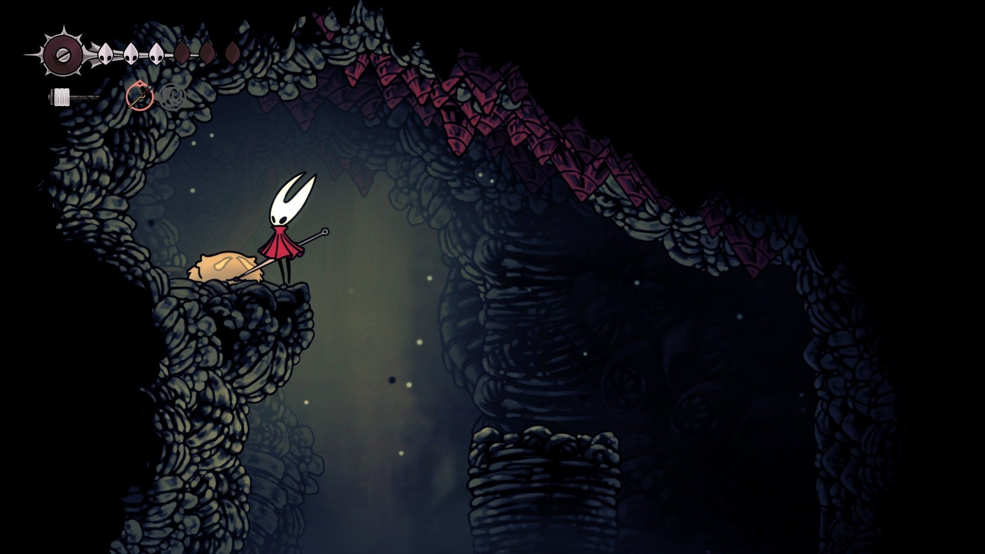 Hornet rescues a sleeping Flea in Blasted Steps in Hollow Knight: Silksong