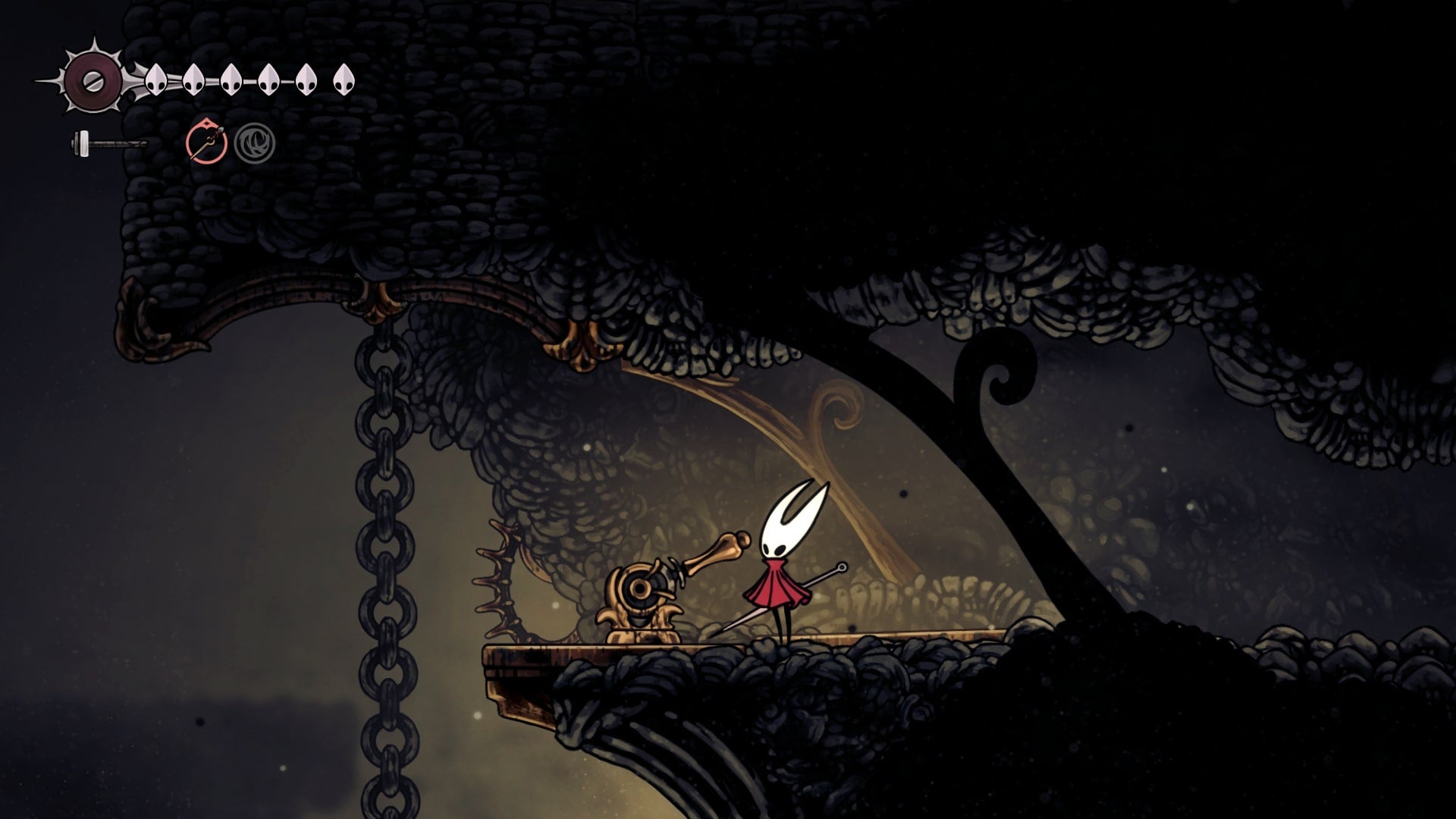Hornet stands beside a lever in Blasted Steps in Hollow Knight: Silksong