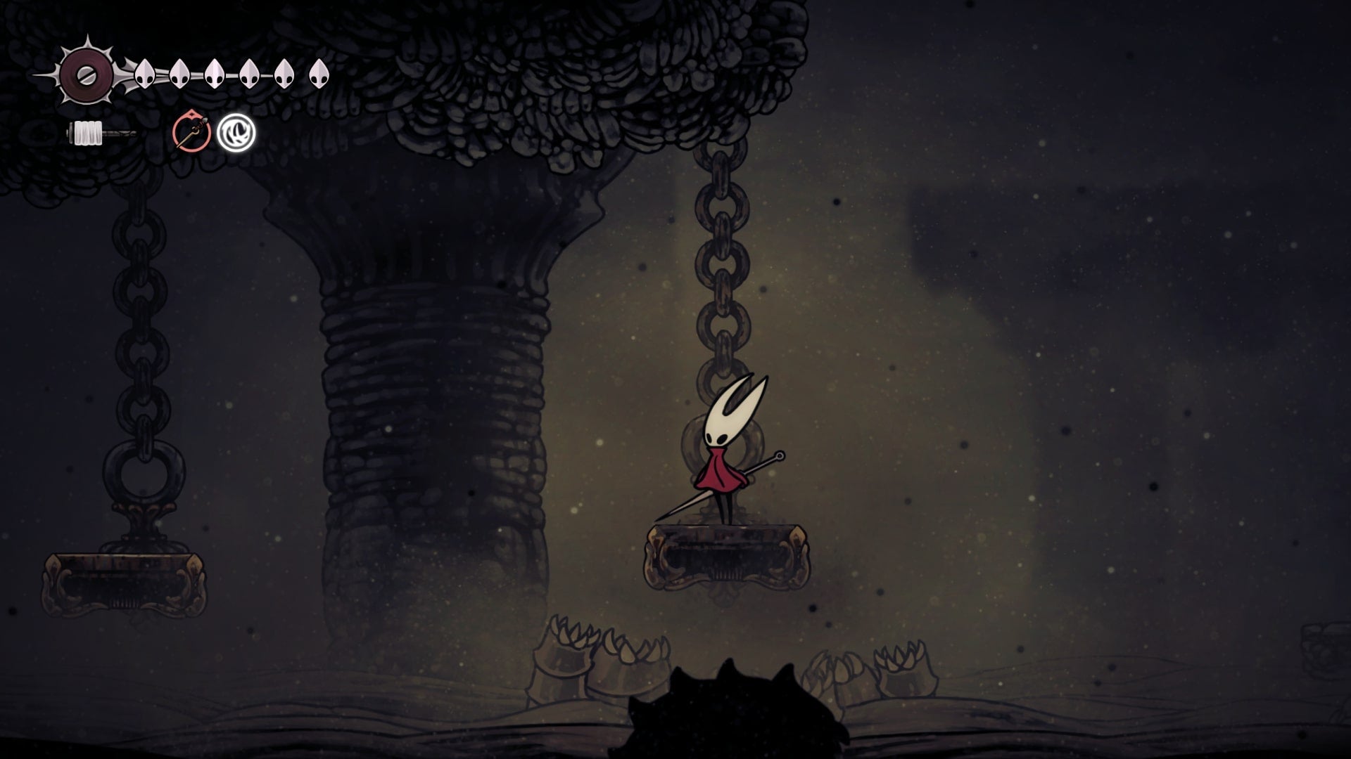 Hornet stands on a gold platform with sandworm enemies beneath her in Blasted Steps in Hollow Knight: Silksong
